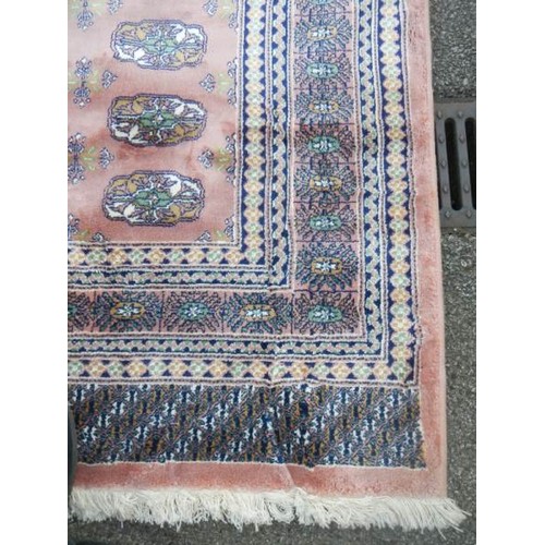 2198 - A pink patterned rug.