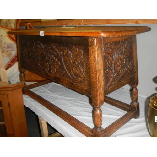 2226 - A heavy oak carved front coffer/chest with vine/grape decoration, COLLECT ONLY.