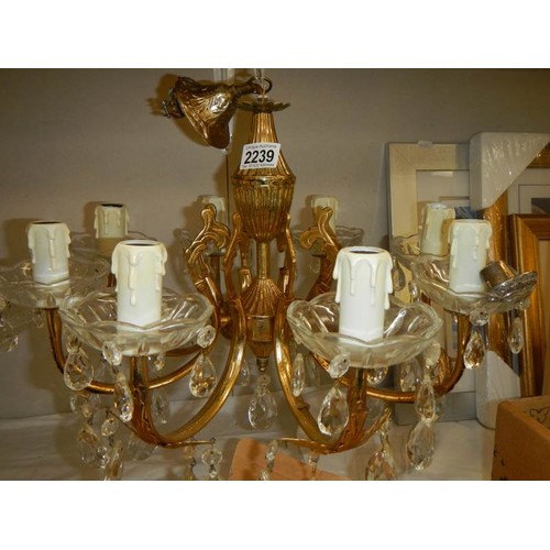 2239 - A late 20th century brass and glass chandelier, COLLECT ONLY.