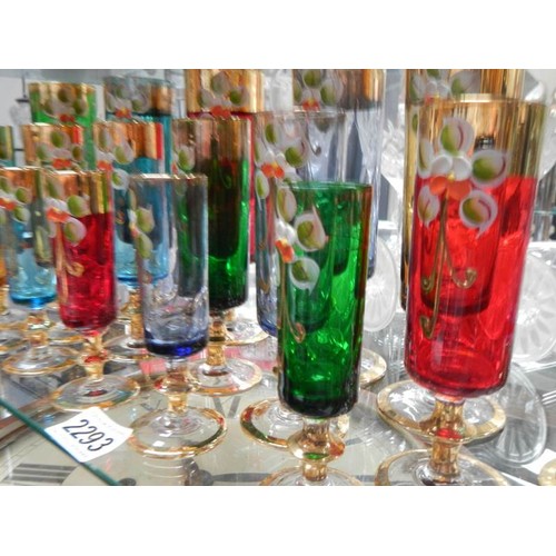 2293 - 17 hand decorated coloured glasses.