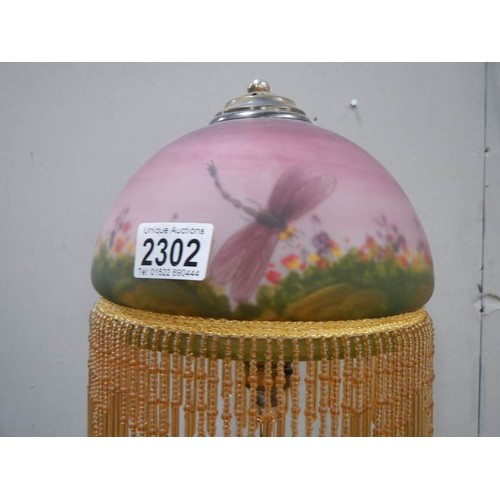 2302 - A mid 20th century figural table lamp with glass painted shade.