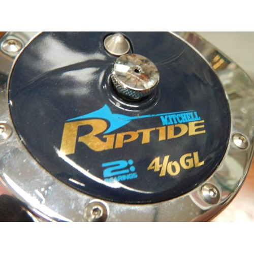 2318 - A Riptide fishing reel with roll of line.