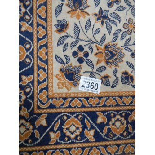 2360 - A small tight woven rug.