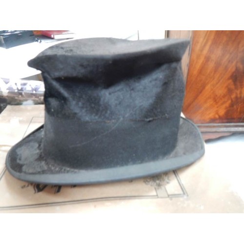 2385 - A well worn top hat in box.