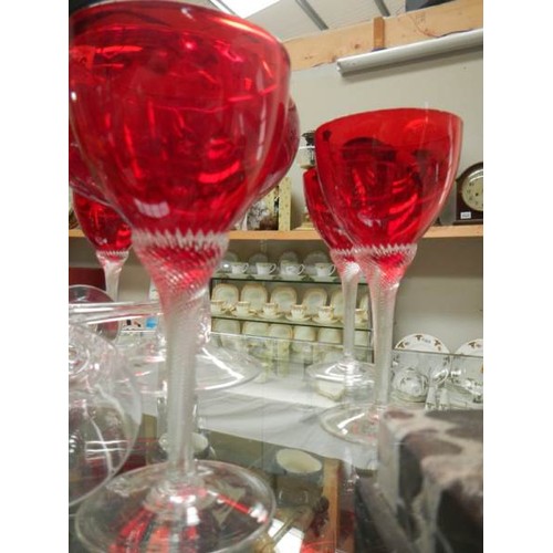 2416 - A large red glass bowl, set of 6 red glasses and two other glasses.