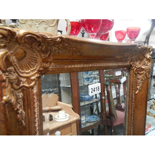 2418 - A long heavy gilt framed bevel edged mirror. COLLECT ONLY.