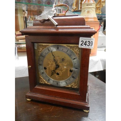 2439 - A mahogany mantel clock.