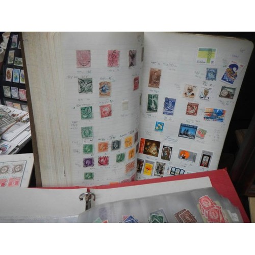 2464 - A large lot of stamp albums and loose stamps.