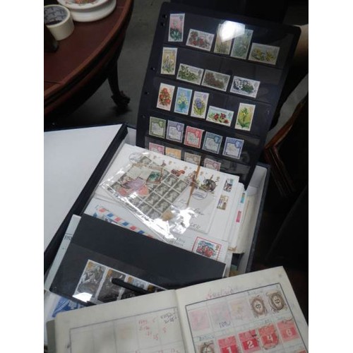 2464 - A large lot of stamp albums and loose stamps.