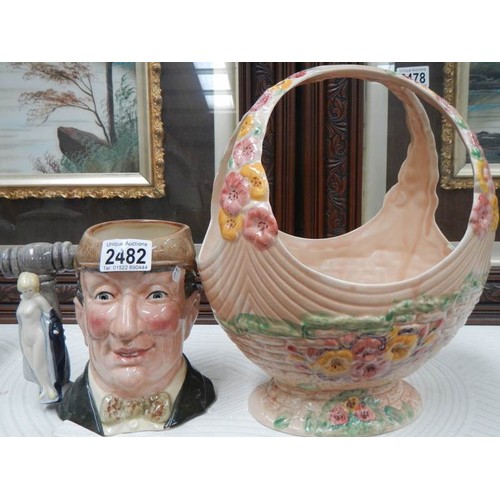 2482 - A Royal Doulton character jug 'The Auctioneer' and a Beswick basket a/f.