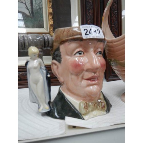 2482 - A Royal Doulton character jug 'The Auctioneer' and a Beswick basket a/f.