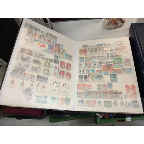 2185 - Three albums of assorted stamps.