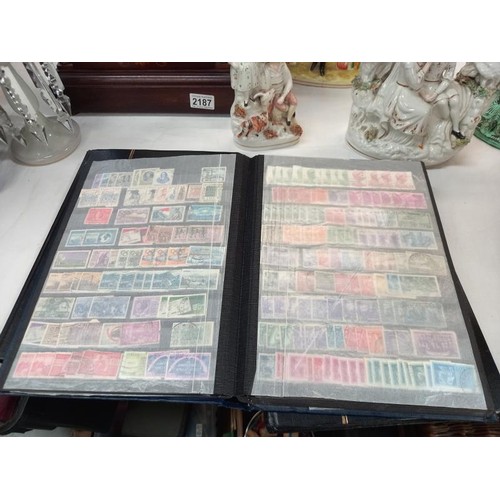 2185 - Three albums of assorted stamps.