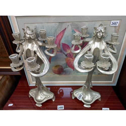 2065 - A pair of silver coloured art nouveau style candelabra.