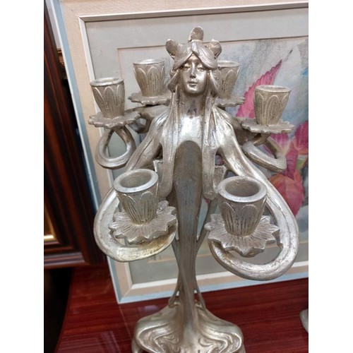 2065 - A pair of silver coloured art nouveau style candelabra.