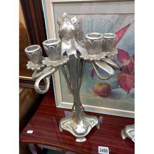 2065 - A pair of silver coloured art nouveau style candelabra.