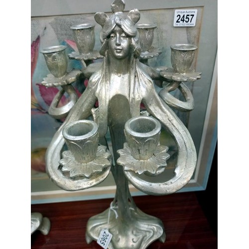 2065 - A pair of silver coloured art nouveau style candelabra.