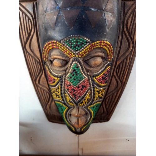 11 - A large African wall mask (75cm x 22cm)