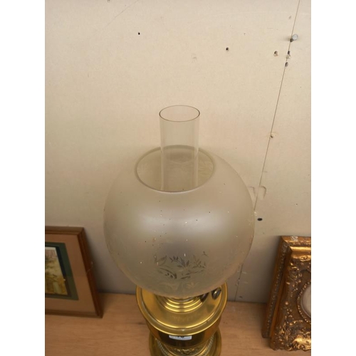 19 - A Victorian brass oil lamp with later etched glass shade. COLLECT ONLY.