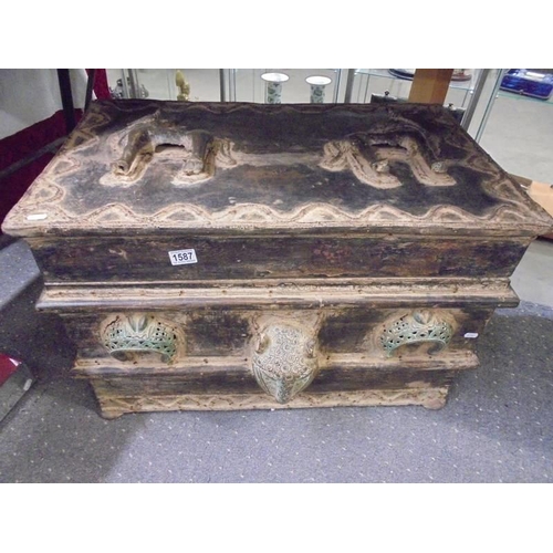 1587 - A large heavy trunk decorated with bronze.