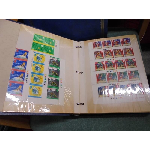 1600 - A box of Royal Mail mint definitive sets and two albums of mint stamps.