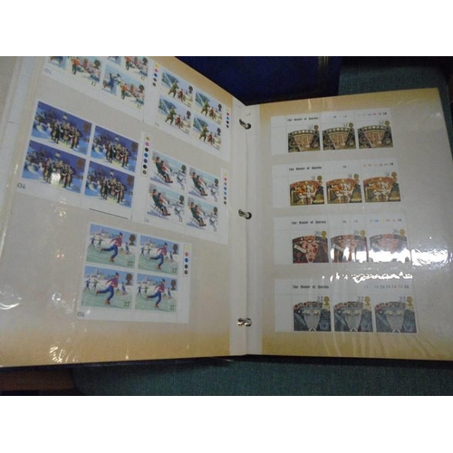 1600 - A box of Royal Mail mint definitive sets and two albums of mint stamps.