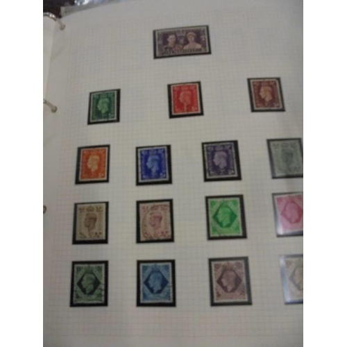 1606 - An album of British stamps including penny black with Maltese cross mark, penny blue, some penny red... 