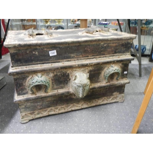 1587 - A large heavy trunk decorated with bronze.