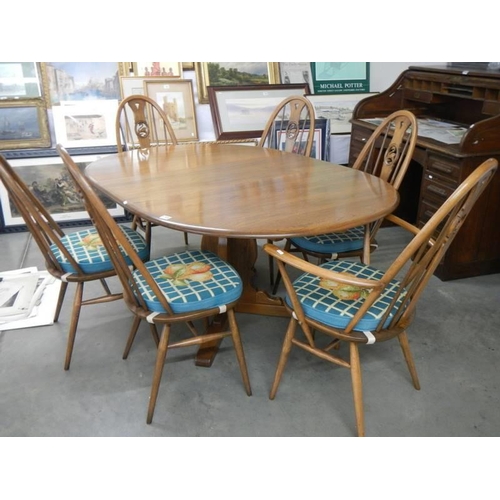 1708 - A good quality Ercol dining table with an extra leaf and six Ercol dining chairs, COLLECT ONLY.