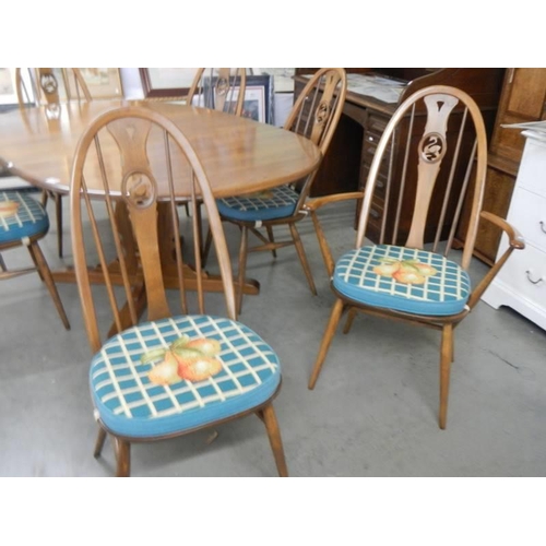 1708 - A good quality Ercol dining table with an extra leaf and six Ercol dining chairs, COLLECT ONLY.