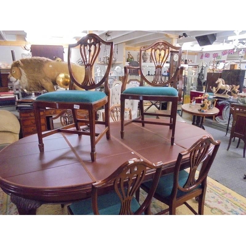 1710 - A mahogany oval extending dining table with one carver and five dining chairs, COLLECT ONLY.