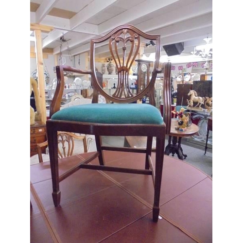 1710 - A mahogany oval extending dining table with one carver and five dining chairs, COLLECT ONLY.