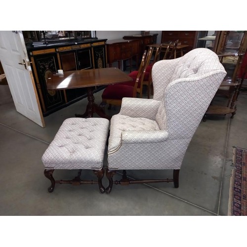 1713 - A mid 20th century mahogany framed, deep buttoned armchair and footstool to match