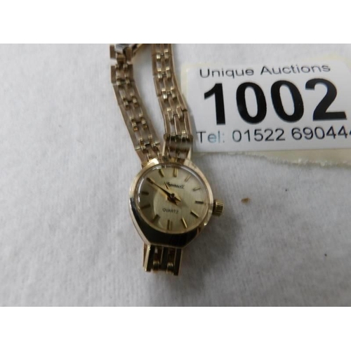 1002 - An Ingersol gold cases ladies wrist watch, needs new battery.