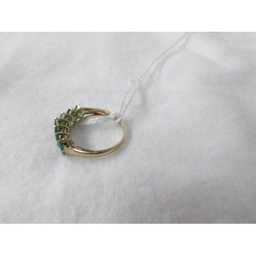 1012 - A 14 stone yellow gold and emerald ring, size N half, 2.3 grams.