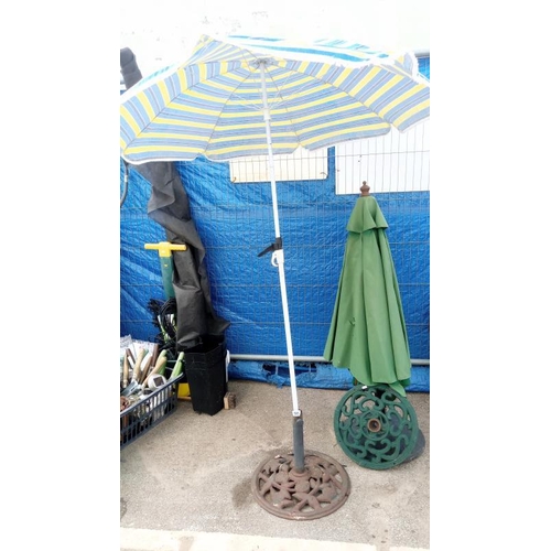 505 - 2 parasols & 2 cast iron bases. Collect Only