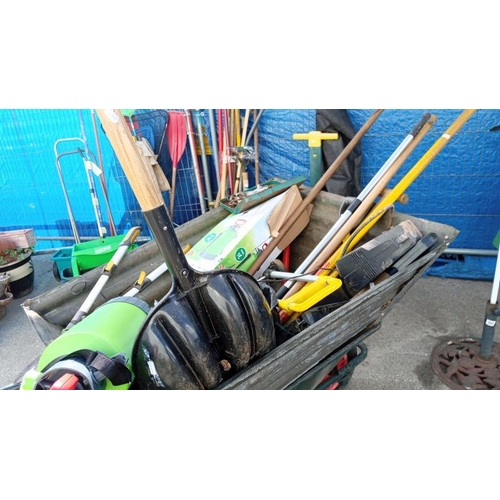 518 - A wheelbarrow & quantity of garden/work tools etc. Collect Only