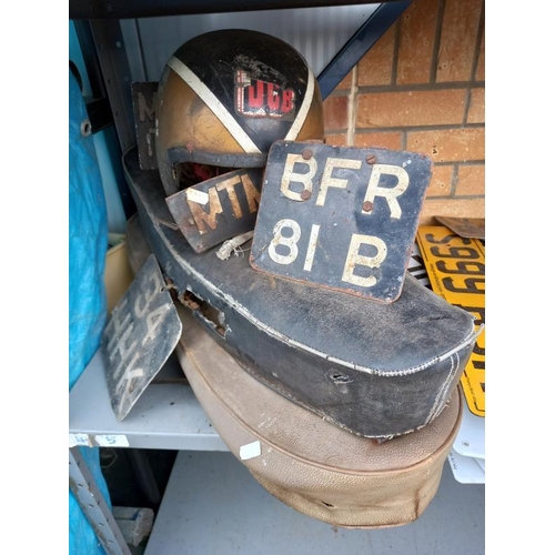 536 - 2 motorcycle seats, a quantity of  American & British number plates and a vintage helmet etc.
Collec... 