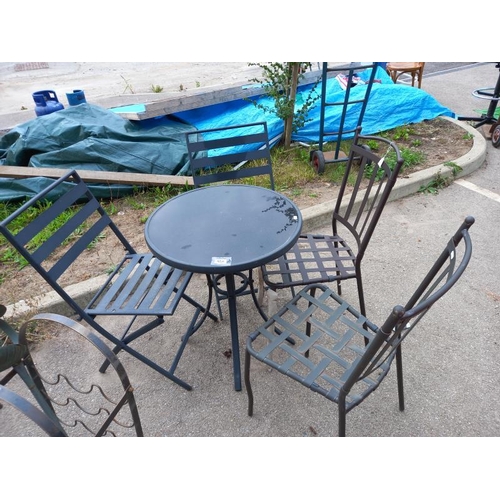 556 - A glass top garden table & 4 chairs. Collect Only