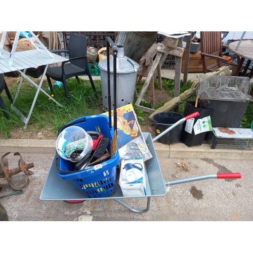 575 - A wheelbarrow with quantity of tools etc. Collect Only