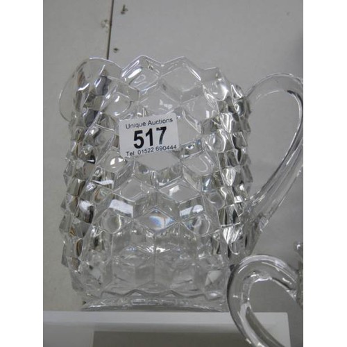 517 - A good quality cube glass vase and a pair of double handled vases. Collect Only.