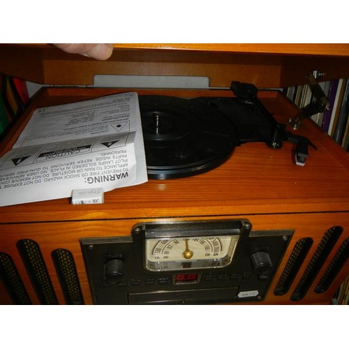 525 - An old 20th century wood cased record player.