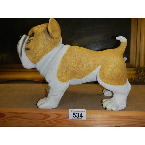 534 - A bulldog figure.