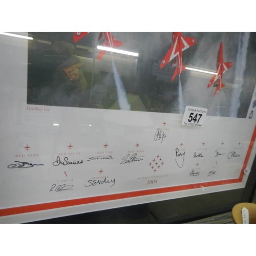 547 - A framed and glazed print of the Red Arrows signed by the pilots. COLLECT ONLY.