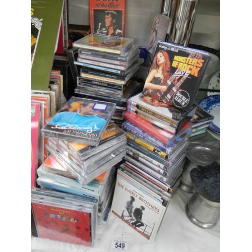 549 - A quantity of CD's and talking book tapes.