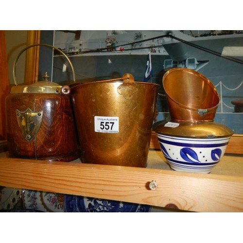 557 - A mixed lot of copper items and a wooden biscuit barrel.