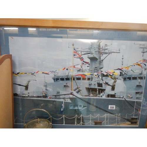 558 - A large framed picture of a battle ship. Collect Only.