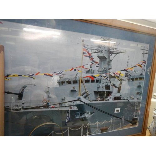 558 - A large framed picture of a battle ship. Collect Only.