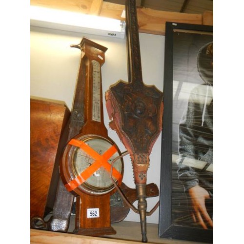 562 - A mixed lot including early 20th century bellows, barometer etc.,