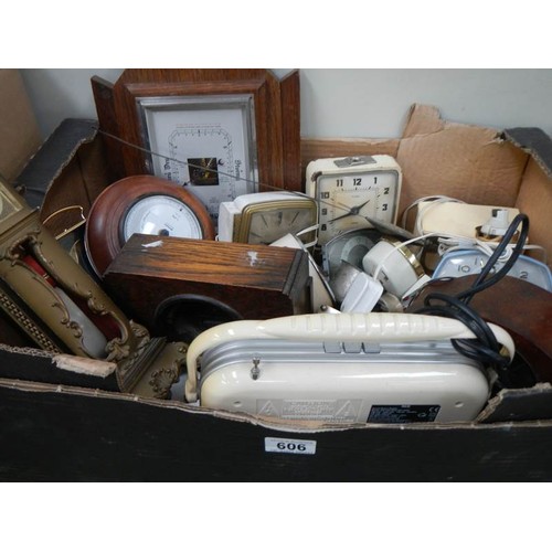 606 - A box of assorted clocks etc.,